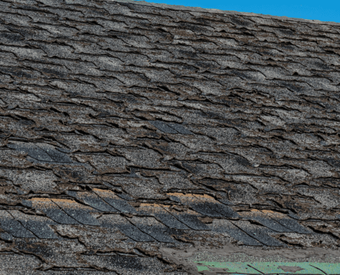 Illustration of a worn-out roof with missing shingles and signs of damage