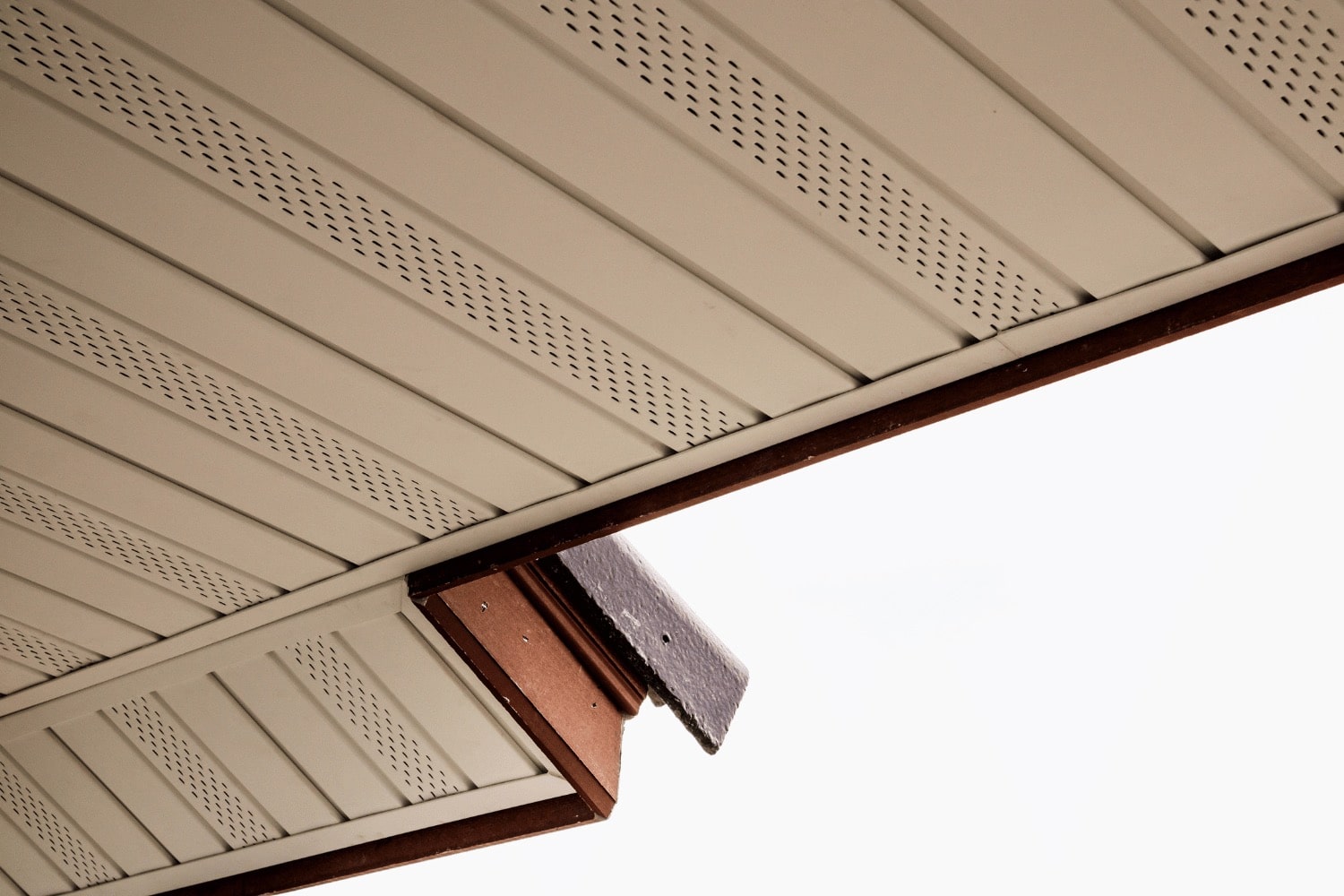 Soffit vents facilitating the escape of hot, moist air through exhaust vents