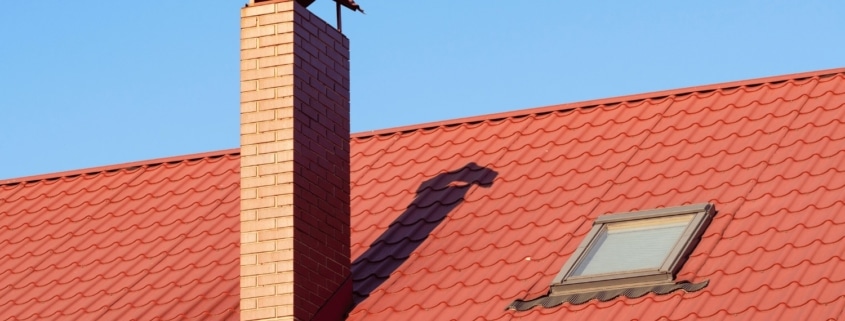 Illustration of different materials used for roof crickets including wood, sloped rigid insulation, and metal flashing