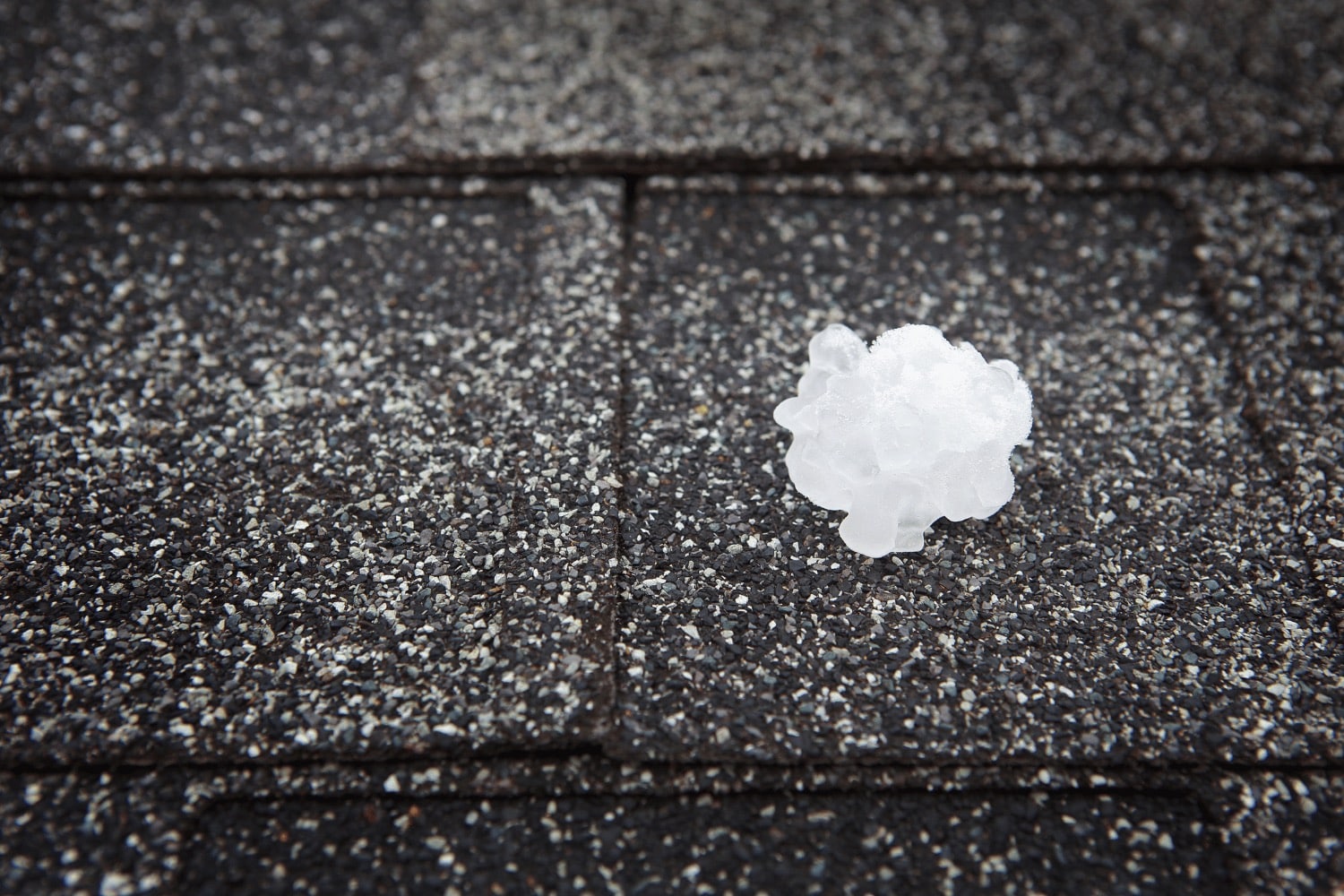 Illustration of hail damage on roof shingles