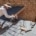 An illustration of a roofing contractor assessing a damaged roof for emergency repairs.
