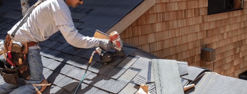 An illustration of a roofing contractor assessing a damaged roof for emergency repairs.