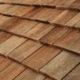 Wood shingles, specifically cedar shakes, displayed for roofing options.