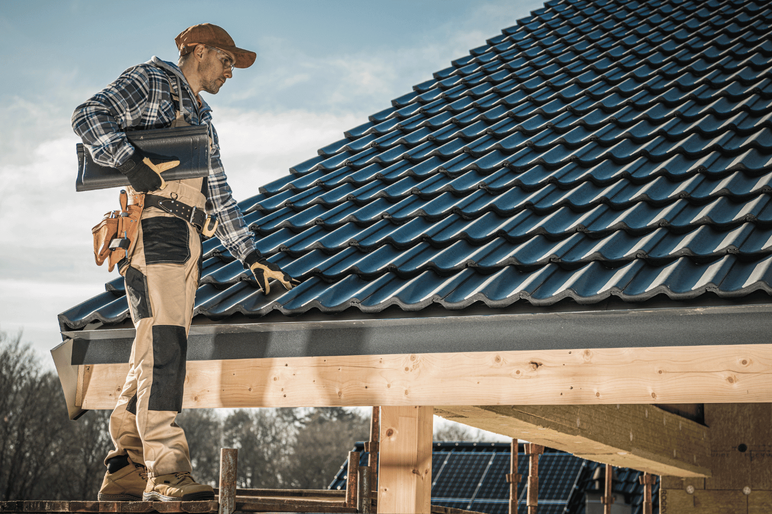 A contractor performing a final roof inspection.