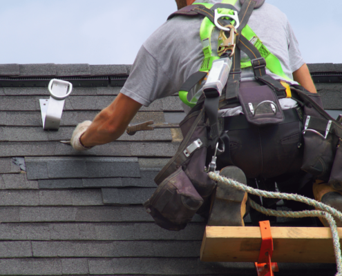 A local commercial roofer working on a roof.