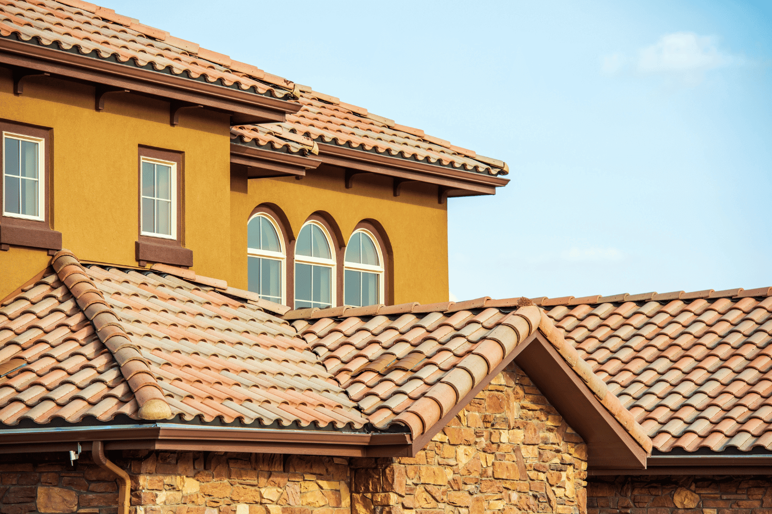 Factors influencing roof lifespan including climate, maintenance, and material quality.