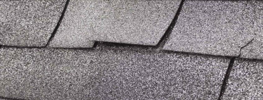 The image displays asphalt shingles, a common roofing material.