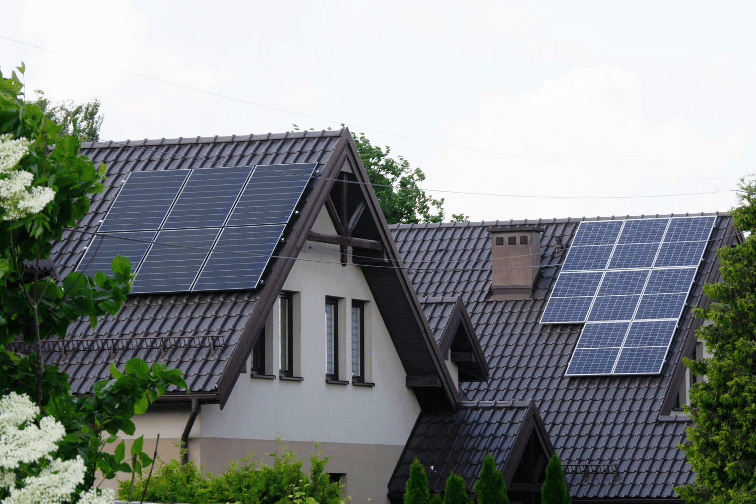 A comparison image of solar shingles versus traditional roofing materials. 