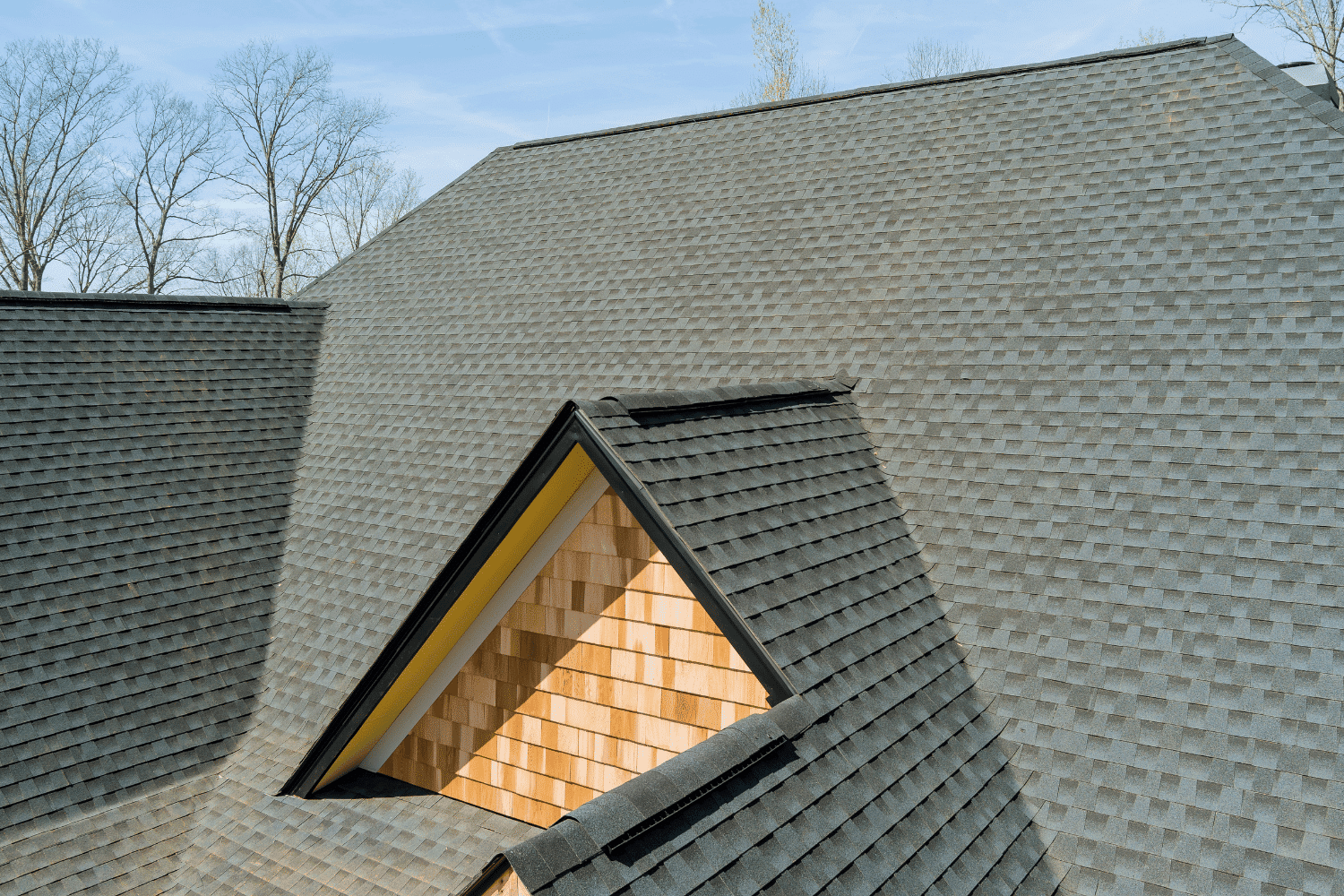 A new roof installation showcasing asphalt shingles and modern roofing systems, emphasizing the importance of roof replacement first.