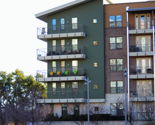 Various roofing materials used for condos, including asphalt shingles and metal roofs.