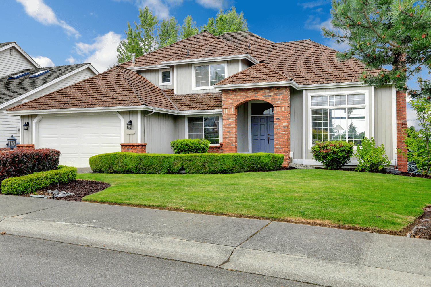 A beautiful house featuring architectural shingles that enhance curb appeal. 