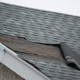Signs indicating the need for roofline repair, including damaged shingles and water stains.