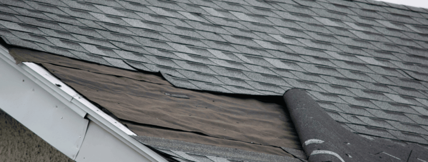 Signs indicating the need for roofline repair, including damaged shingles and water stains.