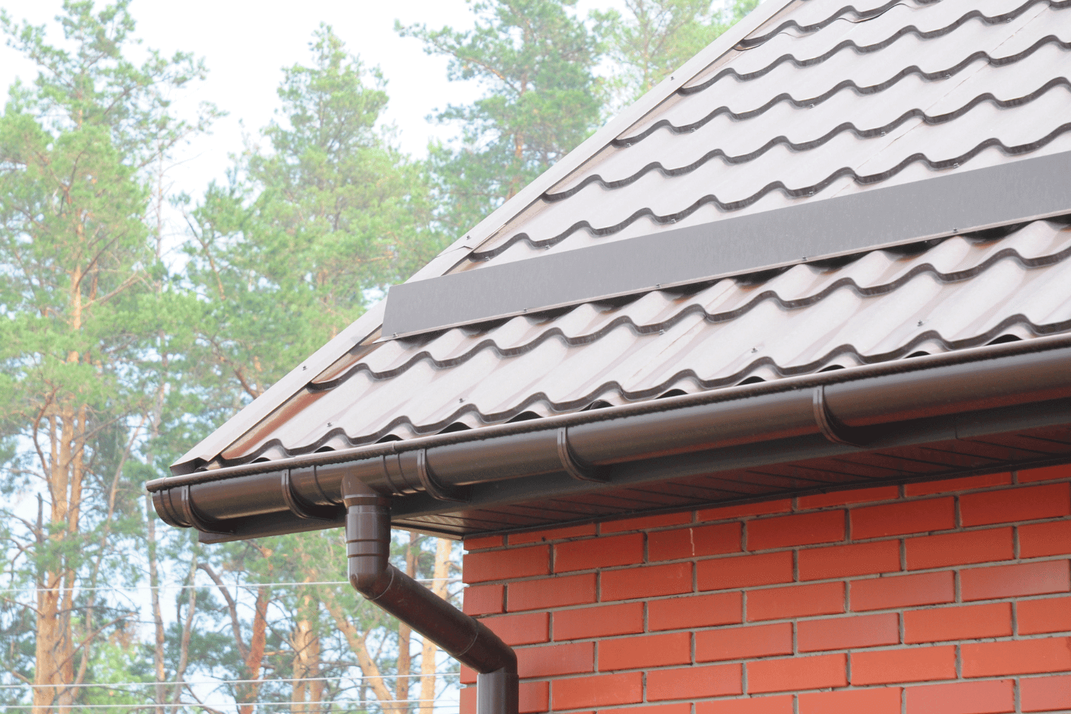 A side-by-side comparison of roof drains and gutters in a building's drainage system. 